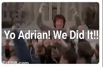 Group Dancing In Front Of Building With Sign Saying Yo Adrian We Did It GIF