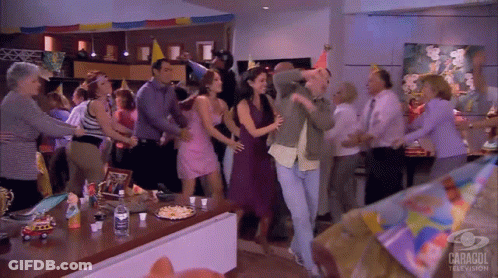 Group Dancing In Front Of Caracol Television Sign GIF