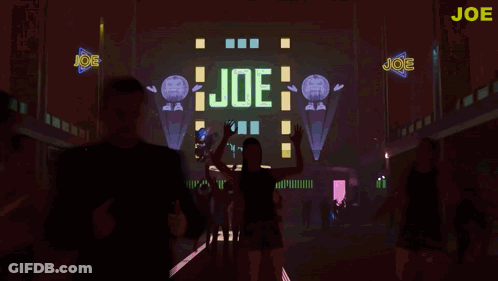 Group Dancing In Front Of Joe Sign GIF