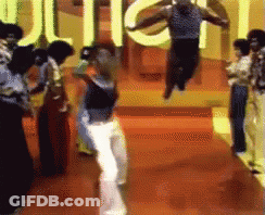 Group Dancing In Front Of Juice Sign GIF