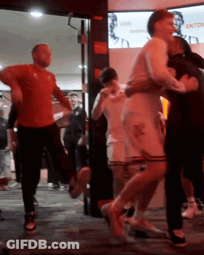 Group Dancing In Front Of Less Shopping Sign GIF
