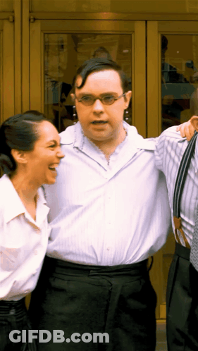 Group Dancing In Front Of Official London Theatre Sign GIF