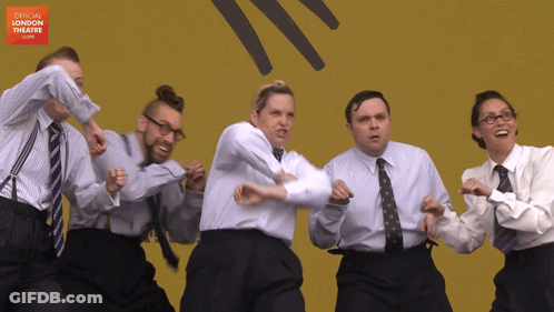 Group Dancing In Front Of Official London Theatre Sign GIF