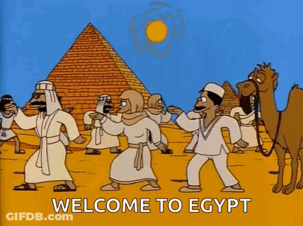 Group Dancing In Front Of Pyramid GIF