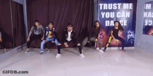 Group Dancing In Front Of Trust Me You Can Dance Sign GIF
