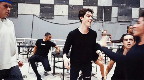 Group Dancing In Room With Fire Exit Sign GIF