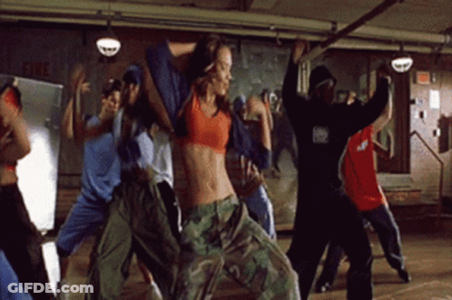 Group Dancing In Room With Fire Sign GIF