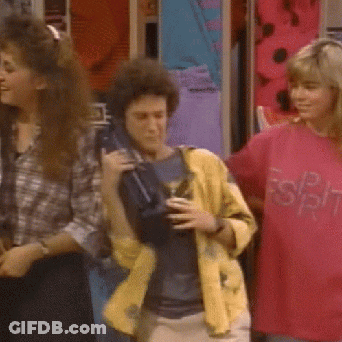 Group Dancing In Room With Man Holding Briefcase GIF