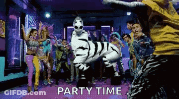 Group Dancing In Room With Zebra Costume Saying Party Time GIF