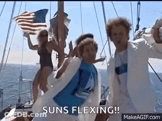 Group Dancing On Boat Holding American Flag GIF