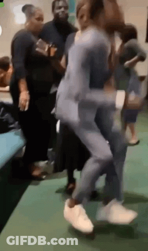 Group Dancing On Green Floor GIF