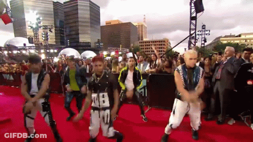 Group Dancing On Red Carpet With Number 28 Shirt GIF