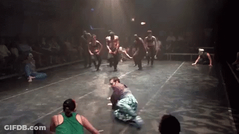 Group Dancing On Stage One In Green Shirt GIF