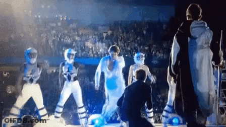 Group Dancing On Stage With Crowd GIF