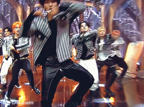 Group Dancing On Stage With Heliapae Text GIF