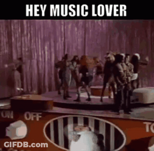 Group Dancing On Stage With Hey Music Lover Sign GIF