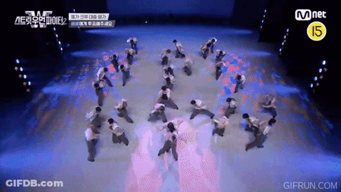 Group Dancing On Stage With Mnet Logo GIF