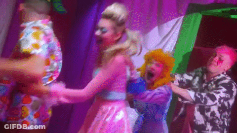 Group Dancing On Stage With Purple Lights GIF