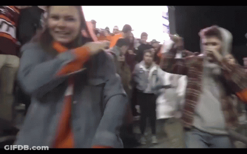 Group Dancing With Man Wearing TNT Hoodie GIF