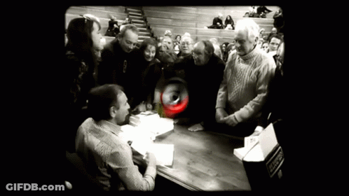 Group Gathered Around Table Saying Emergency GIF