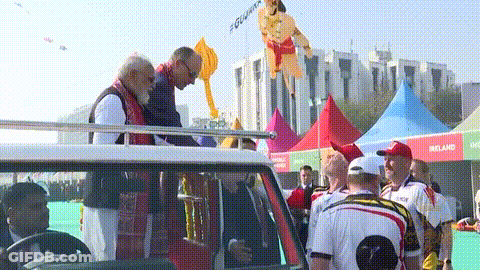 Group Gathered In Front Of Ireland Tent GIF