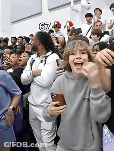 Group Gathered In Front Of Sign Saying 67 GIF