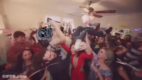 Group Gathered In Room With The Cup Sign GIF