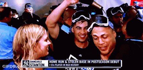 Group Gathered Under Giancarlo Stanton Banner GIF