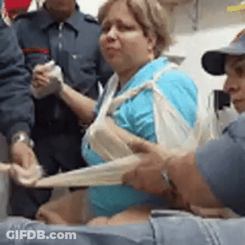Group Helping Woman With Bandage On Arm GIF
