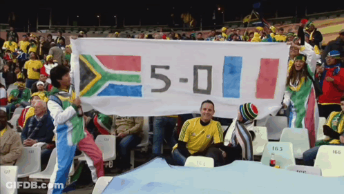 Group Holding Banner Saying 5-0 GIF