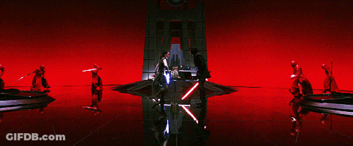 Group Holding Lightsabers In Red Room GIF