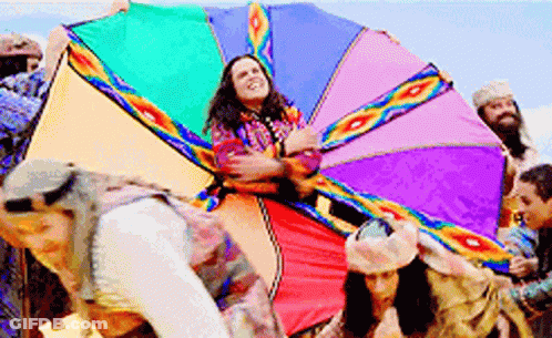 Group Holding Rainbow-Colored Kite GIF