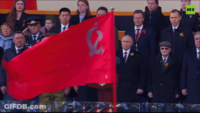 Group Holding Red Flag With E GIF