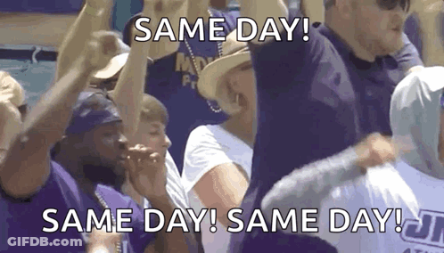 Group Holding Signs Saying Same Day GIF