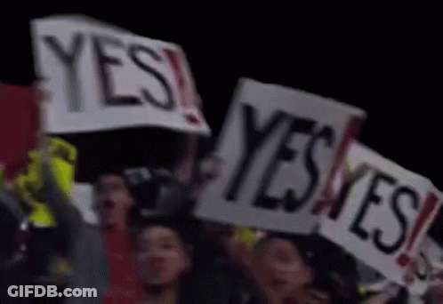 Group Holding Signs Saying Yes GIF