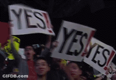 Group Holding Signs Saying Yes GIF