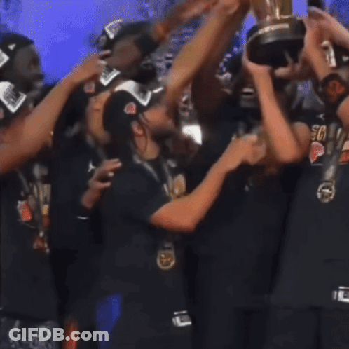 Group Holding Trophy, Person In Crying Face Shirt GIF