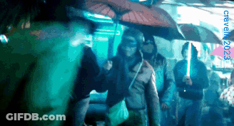 Group Holding Umbrellas 2023 GIF