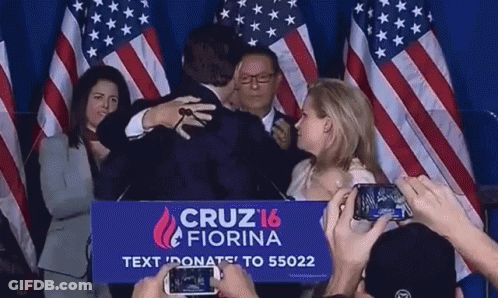 Group Hugging Man In Front Of Cruz 16 Fiorina Sign GIF