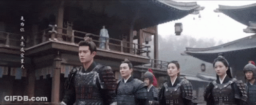 Group In Armor In Front Of Building With Chinese Writing GIF