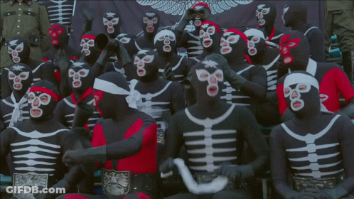 Group In Black And White Masks With Red Headband GIF