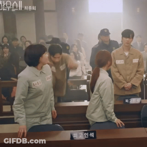 Group In Courtroom With 1013 Sign GIF