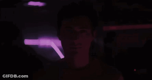 Group In Dark Room With FX Shirts GIF