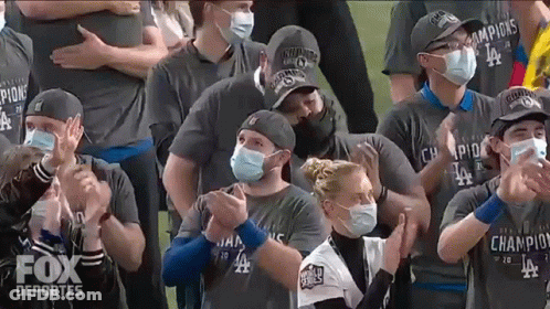 Group In Face Masks And Fox Deportes Shirts Clapping GIF