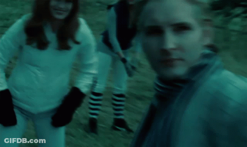 Group In Field With NY Baseball Cap GIF