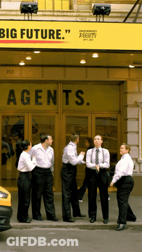 Group In Front Of Building Saying Agents GIF