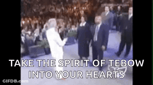 Group In Front Of Crowd Take The Spirit Of Tebow Into Your Hearts GIF