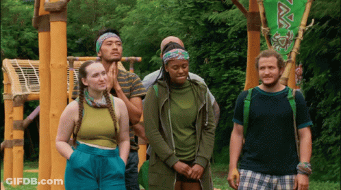 Group In Front Of Green Flag Saying Vava GIF