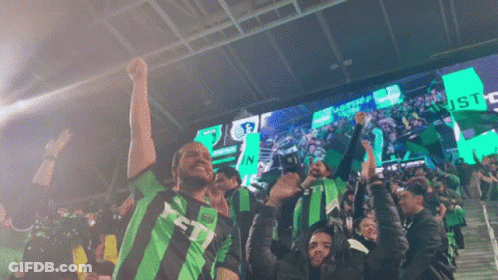 Group In Green And Black Striped Shirts With Letter T GIF