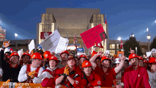 Group In Hard Hats Holding Signs Saying Remember When You Were A Little Girl GIF